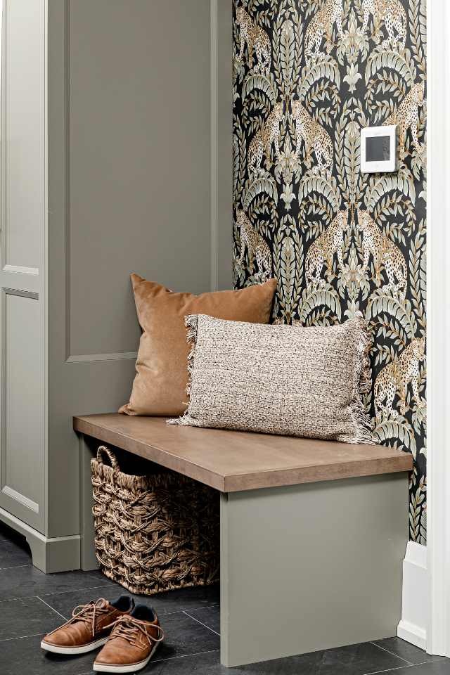 designer entryway with tile floors and jewel toned wallpaper
